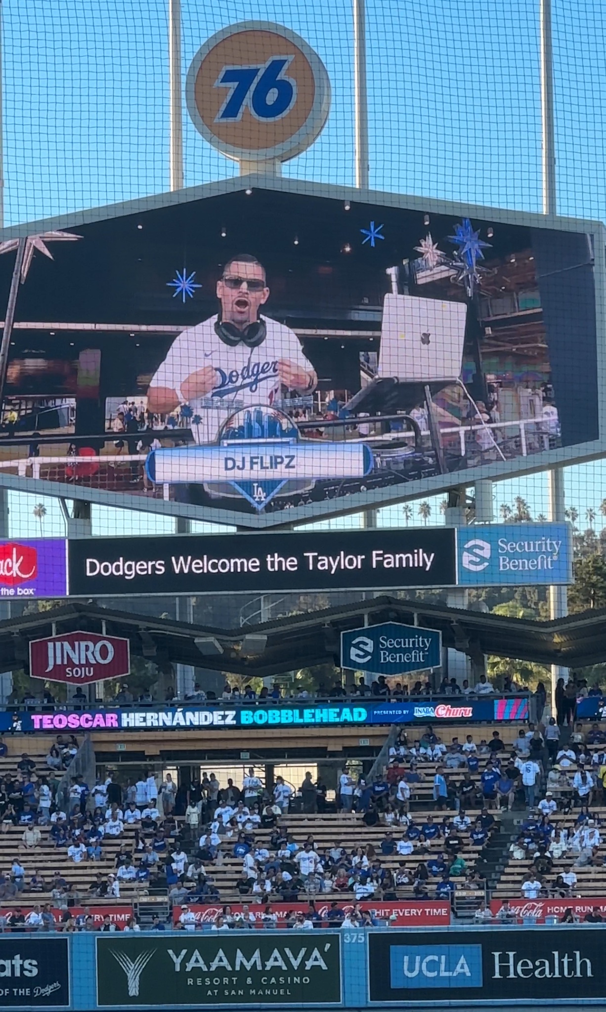 DJ FLiPZ performing on the video screen at Dodger Stadium